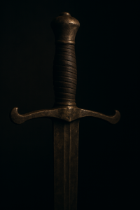A sword hilt disappearing into shadow, symbolising what remains untold
